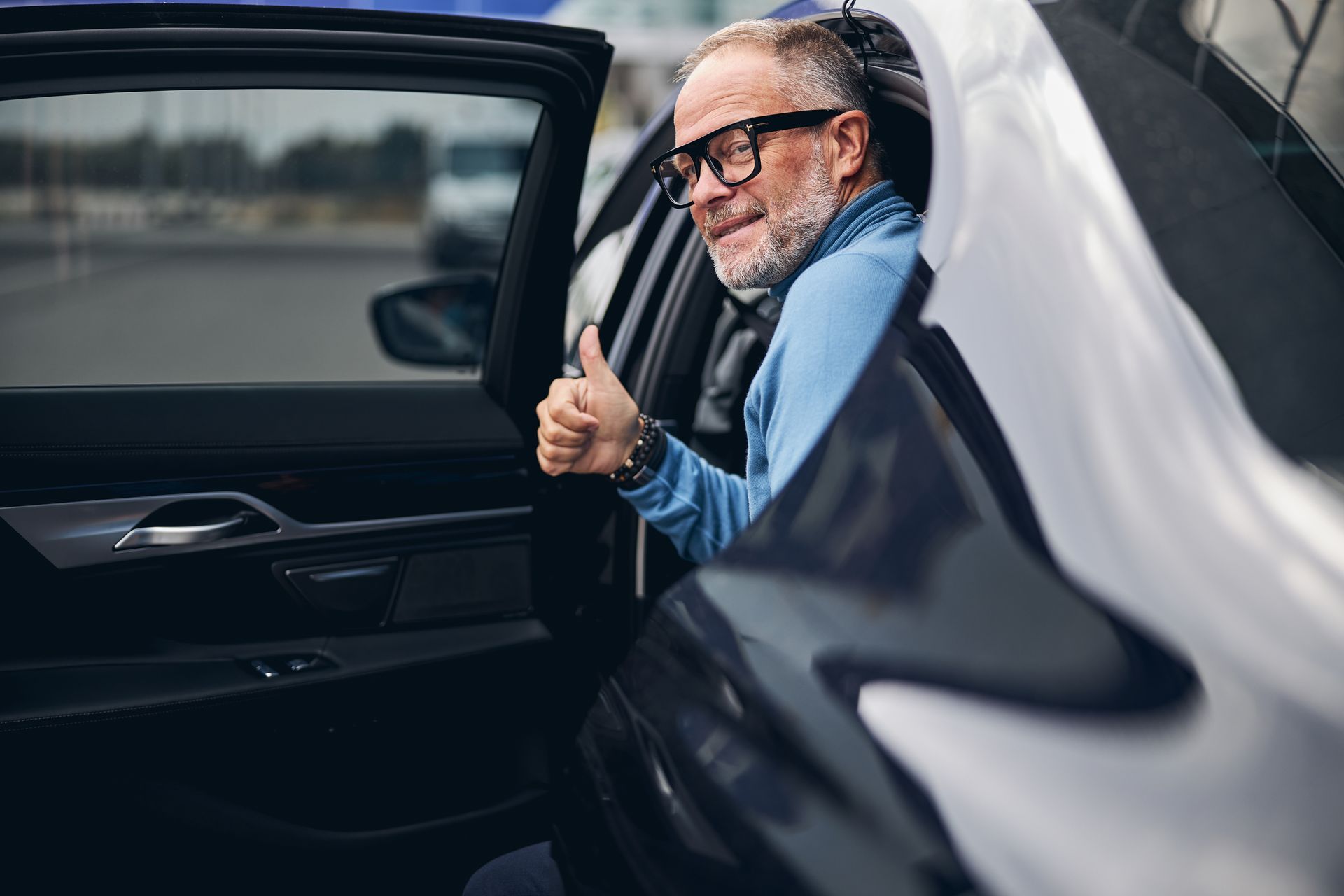 Businessman entering A Hudson Valley Limousine exclusive vehicle for airport transportation services in Poughkeepsie, NY