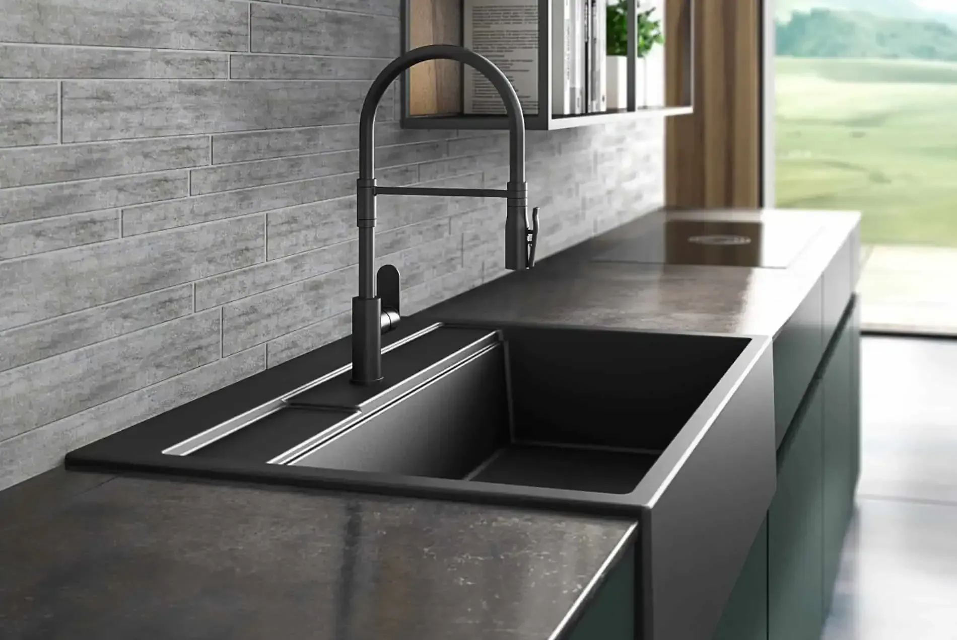 Moderno lavello da cucina con rubinetto nero su un piano di lavoro grigio, con sfondo di parete in pietra.