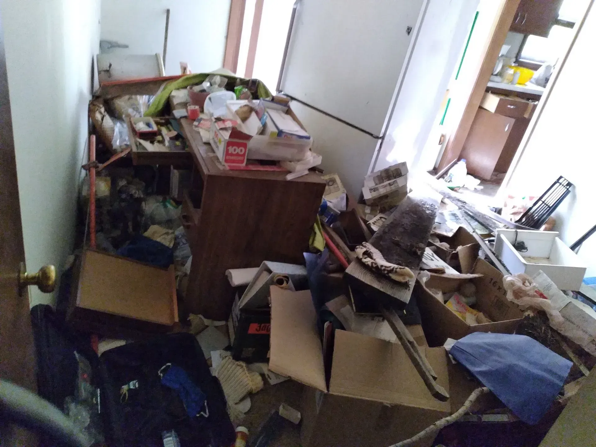 A room with a lot of boxes on the floor