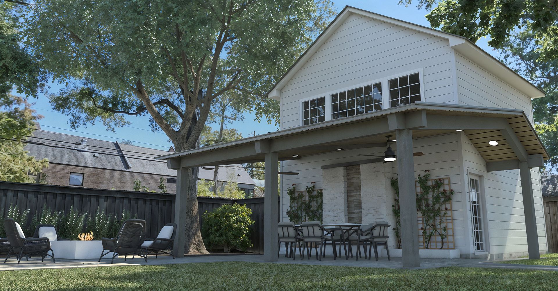 A white house with a porch and chairs in front of it.
