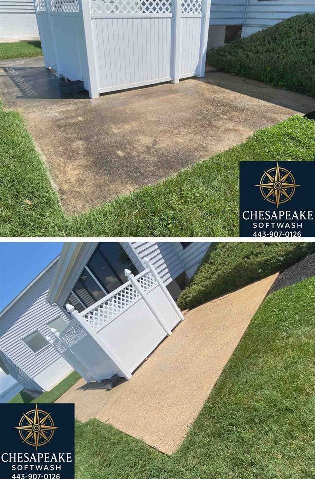 Patio before-and-after: stained concrete replaced with tan paver patio beside a white shed and lawn