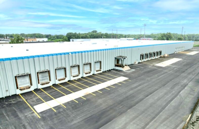 An aerial view of a large warehouse with a lot of loading docks.