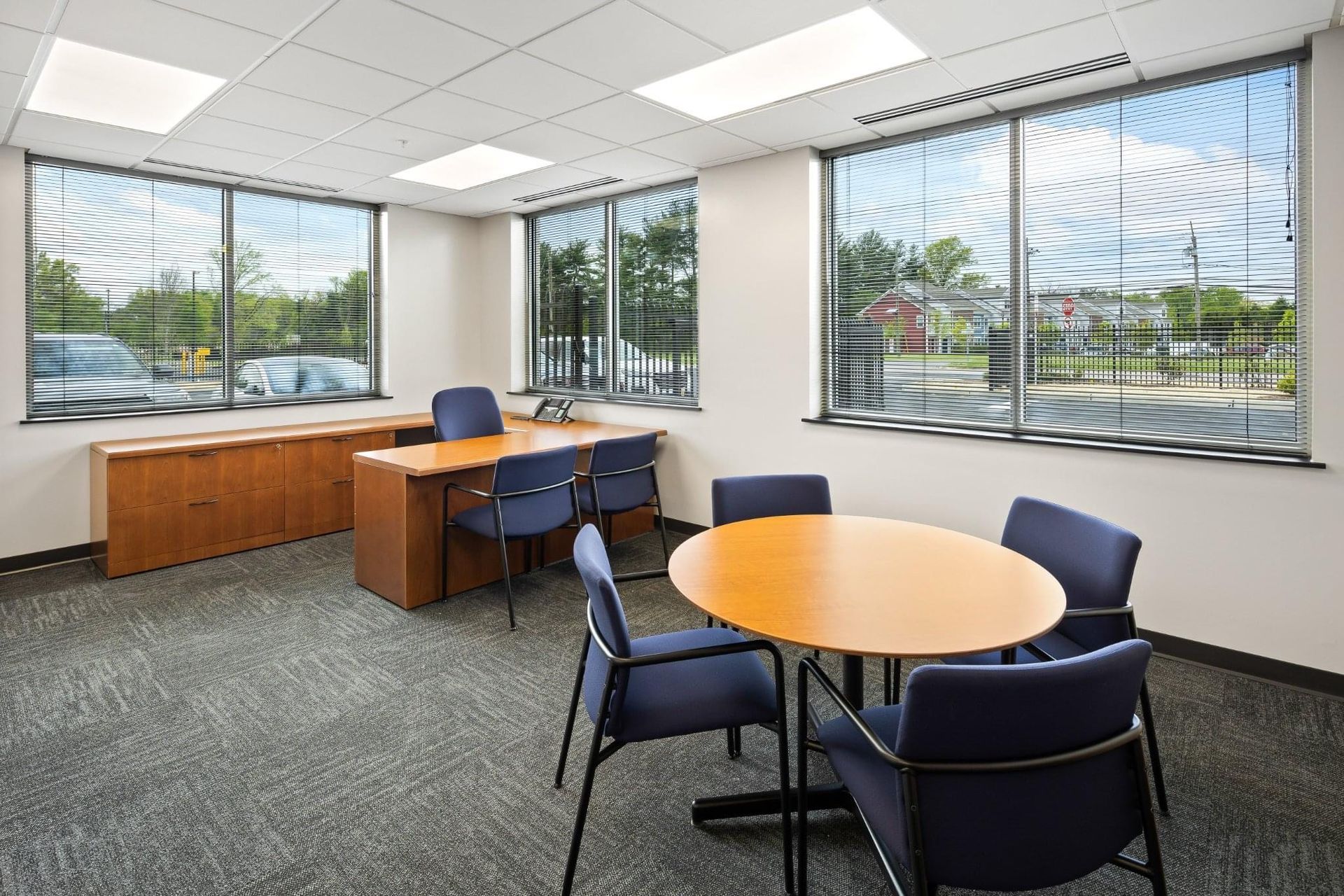 A room with a table and chairs in it