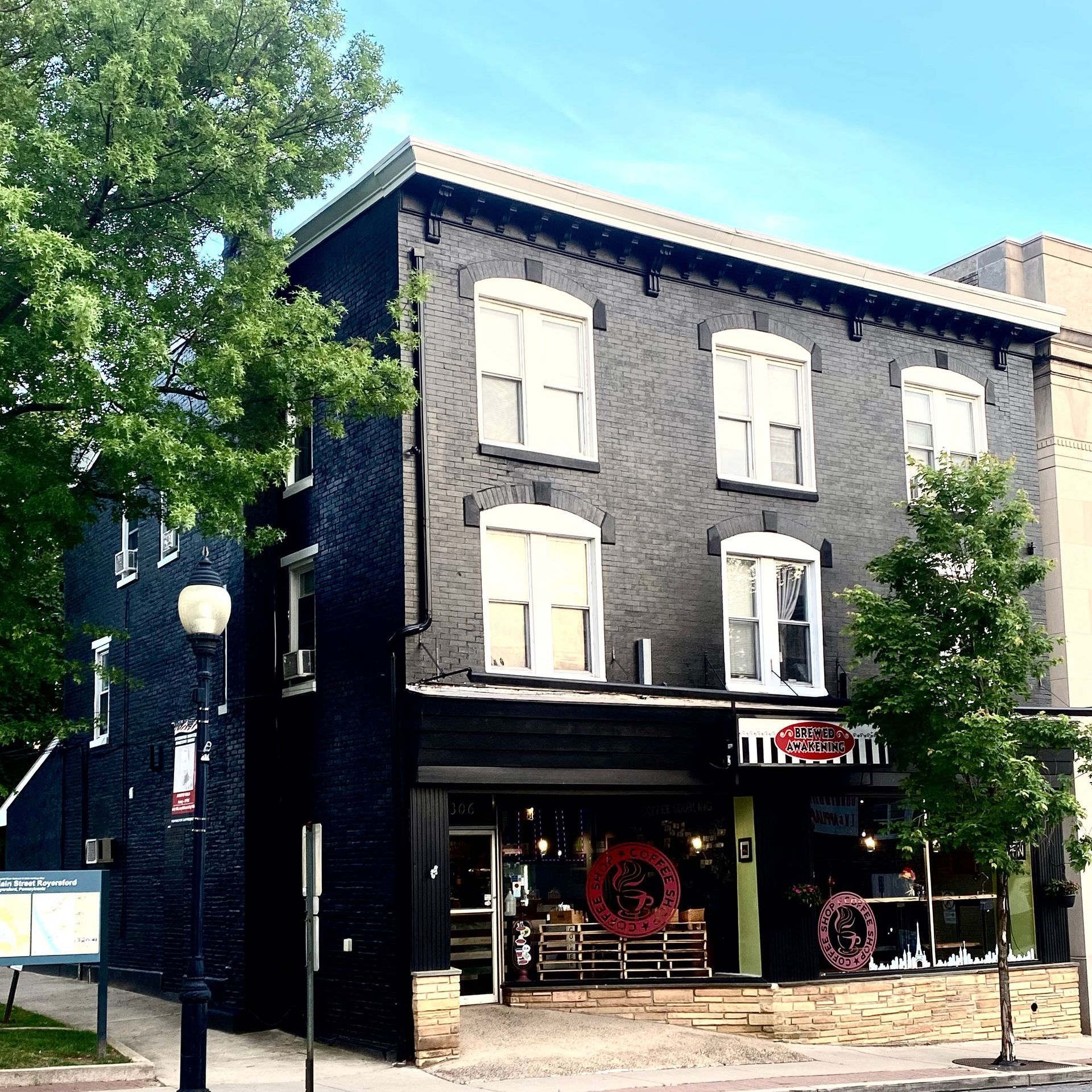 A large black building with a wreath in front of it