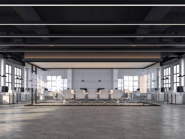 Modern industrial conference room with polished concrete floors and glass partitions