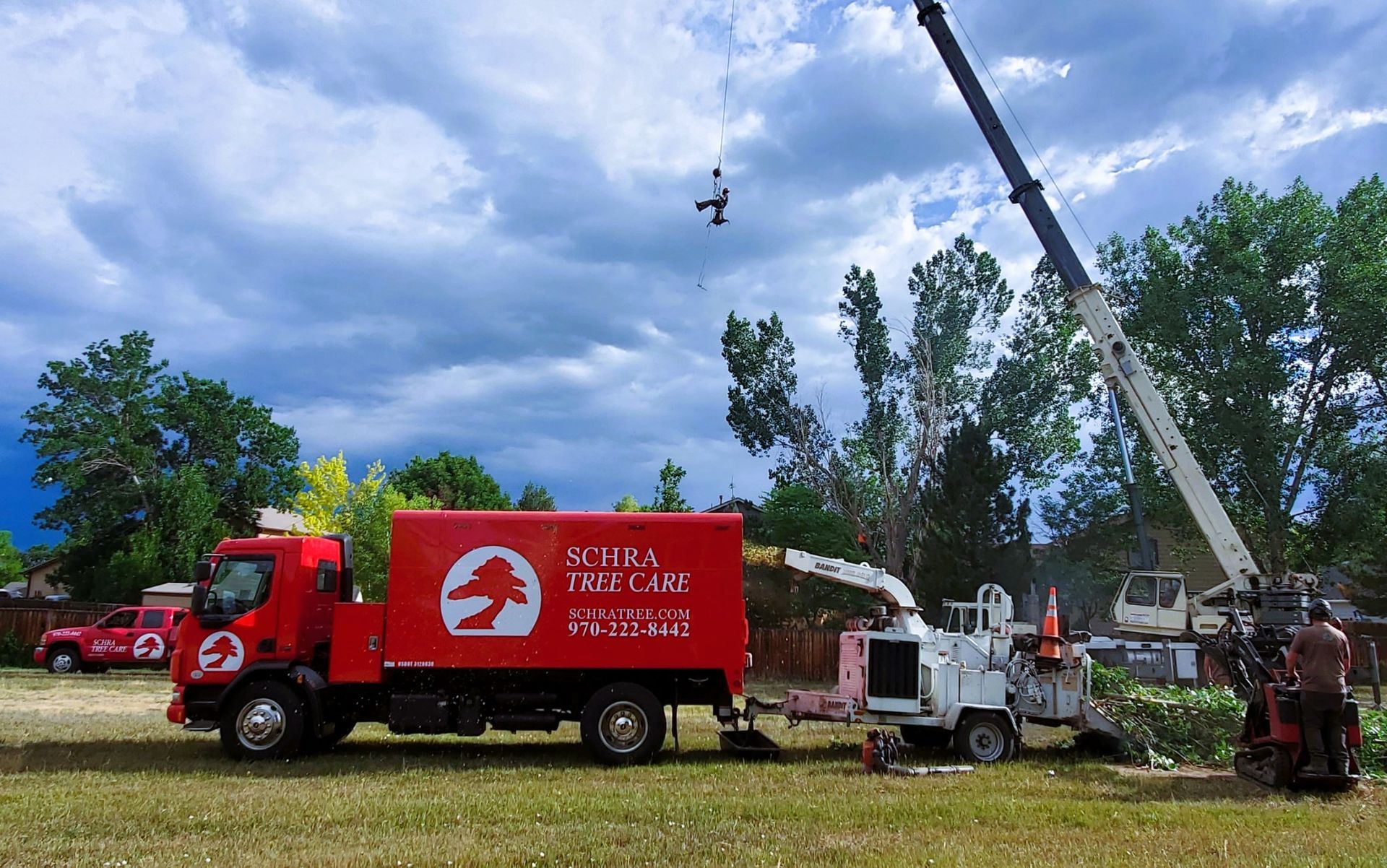 Tree Service Crane and Truck In Action
