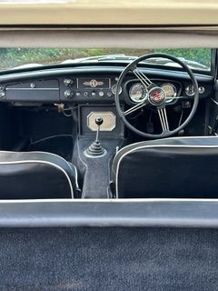 Interior view of a white MGC GT 3 seats