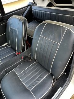 Interior view of a white MGC GT 3 seats