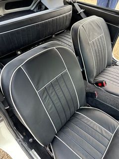 Interior view of a white MGC GT 3 seats