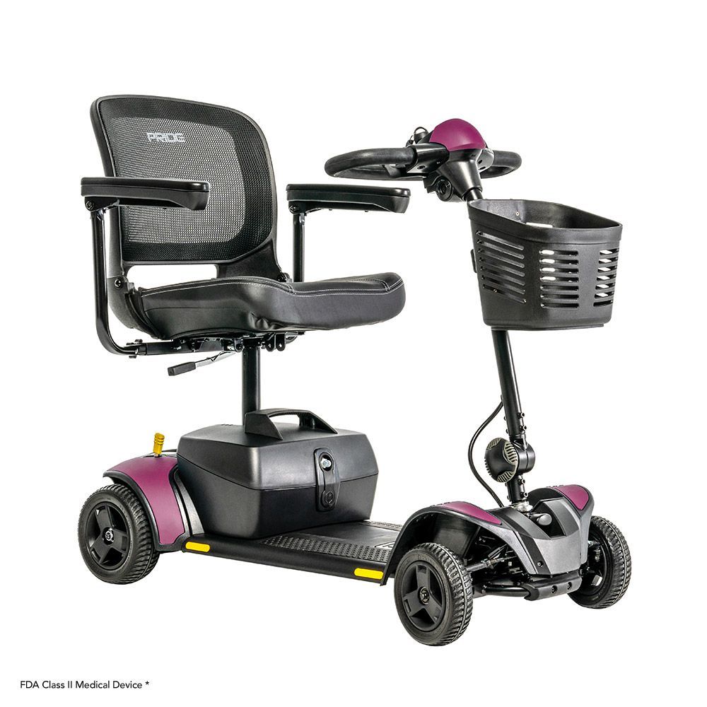 Black mobility scooter with seat, basket, and four wheels on a white background