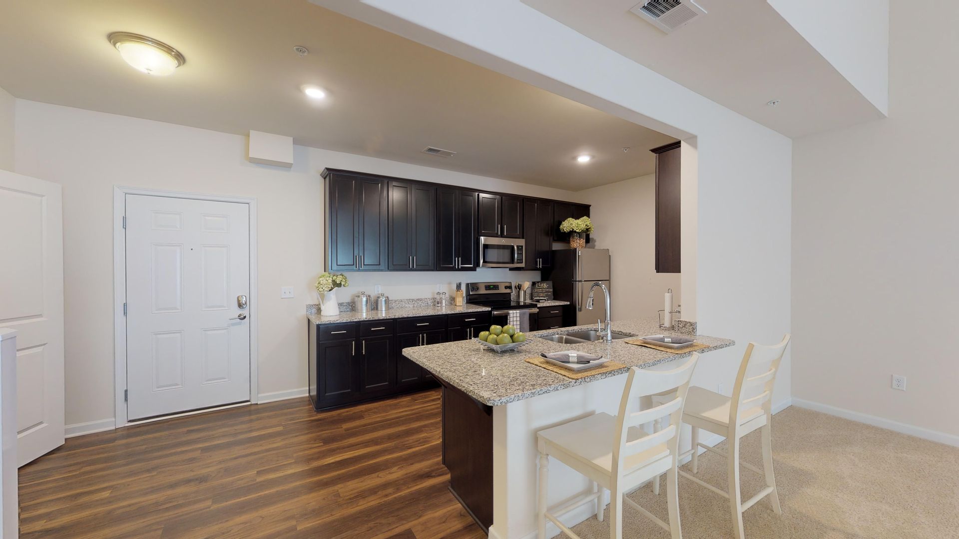 A kitchen with a large island in the middle of the room.