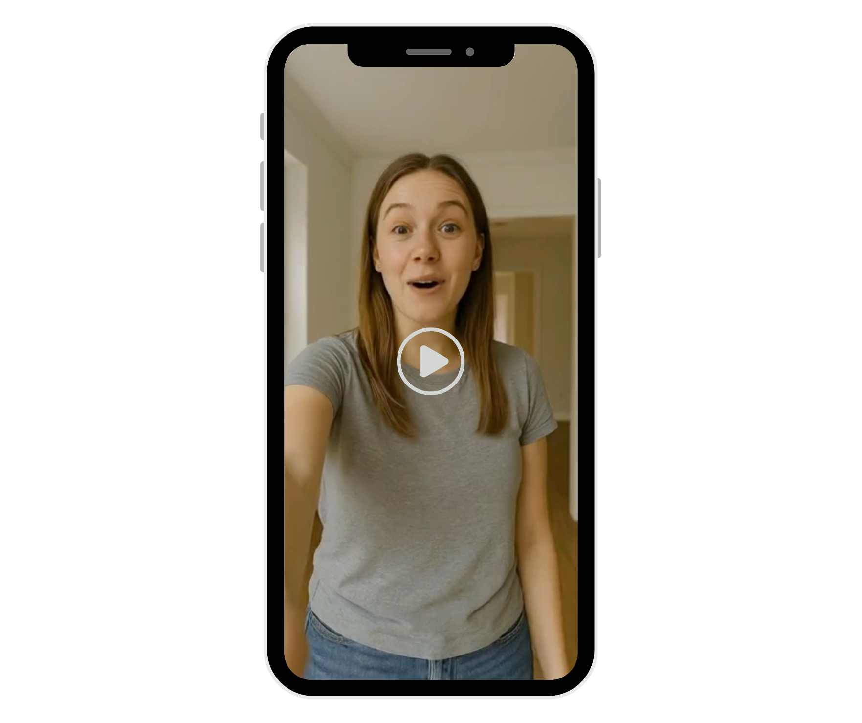 A person in a gray t-shirt speaks to the camera in a video interface on a smartphone.