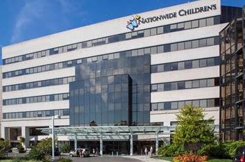 Nationwide Children's Hospital exterior with a white facade and blue logo above the entrance.
