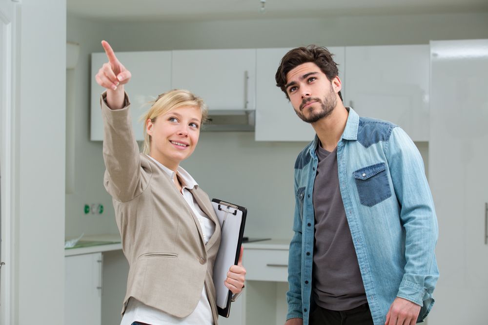 Prospective renter touring an apartment with a leasing professional