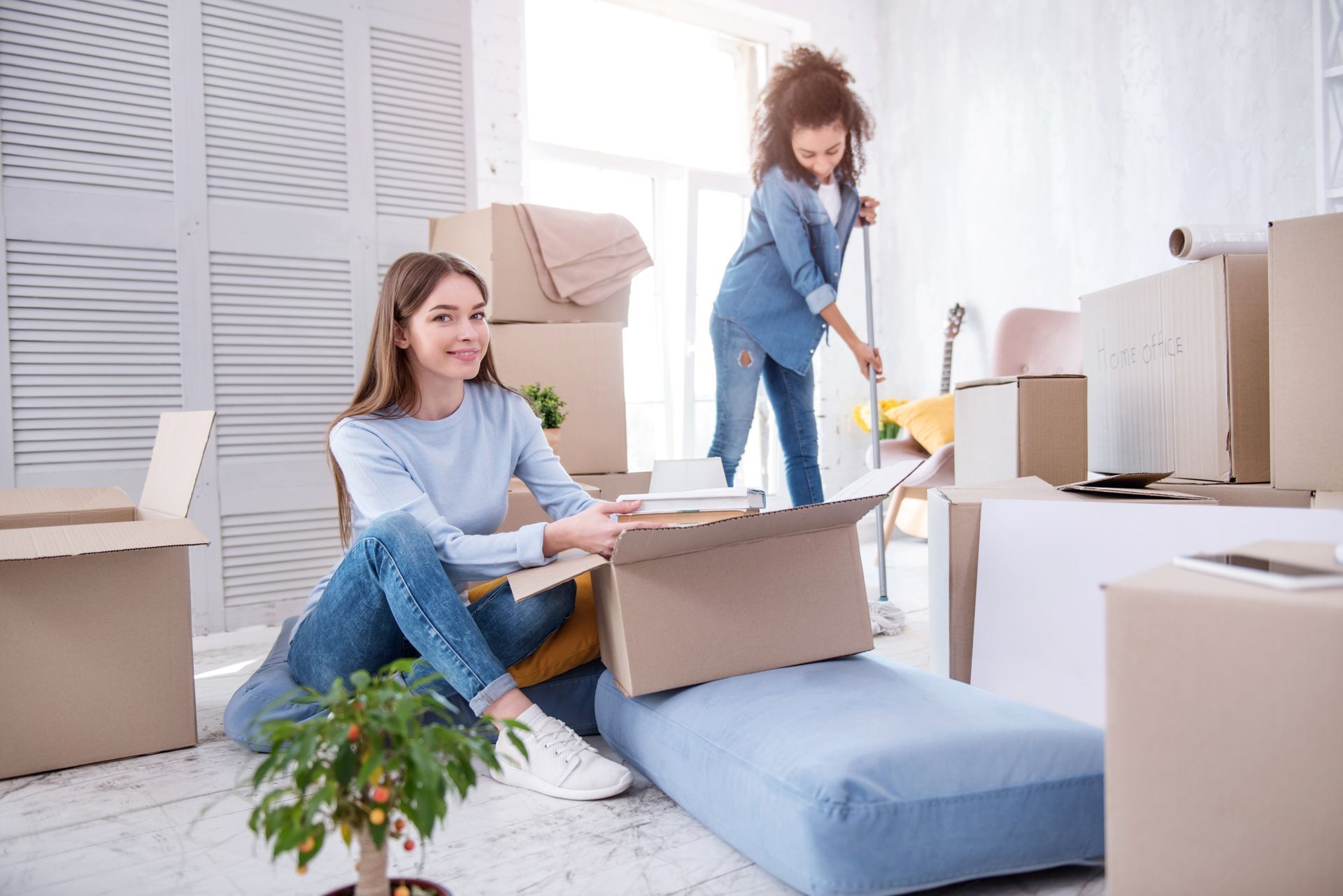 College roommates unpacking their new apartment.