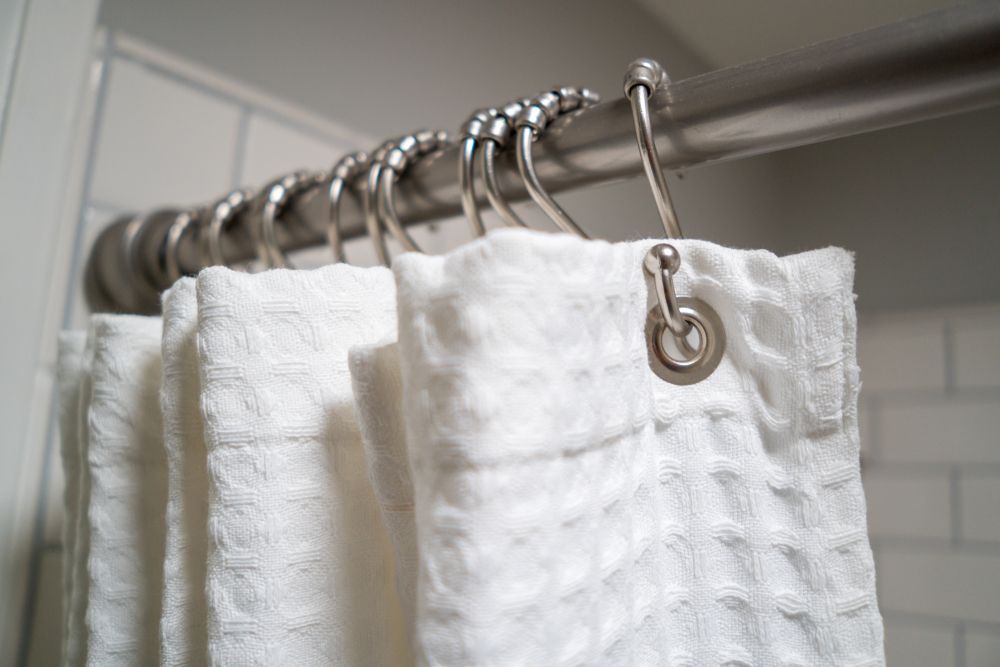 shower curtain hanging on a shower rod