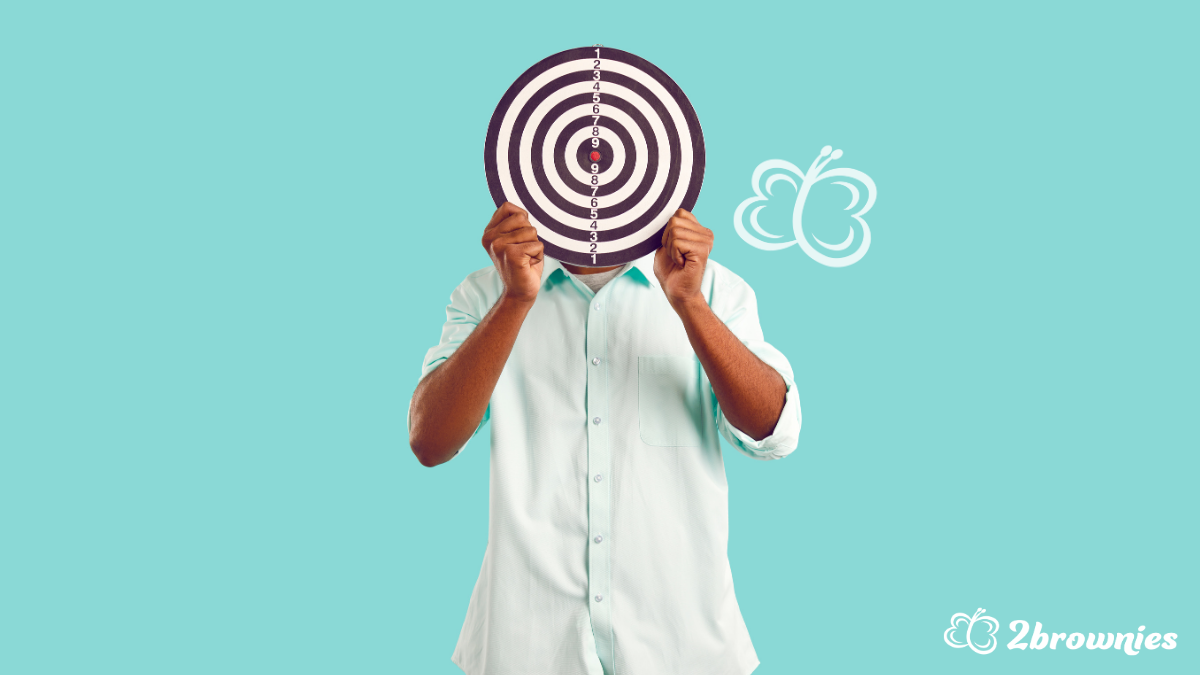 Person covering face with target board