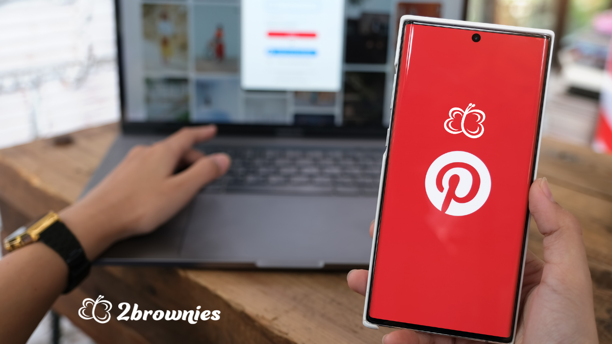 Man holding a smartphone that displays the Pinterest Screen