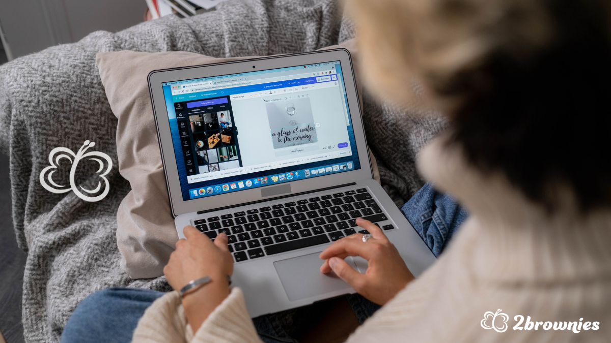 Woman creating a design on Canva on her laptop