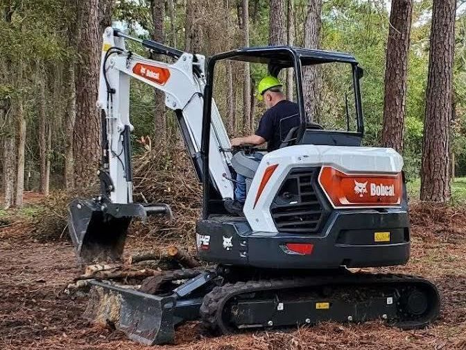 Track loader clearing a lot in Conroe, Texas.