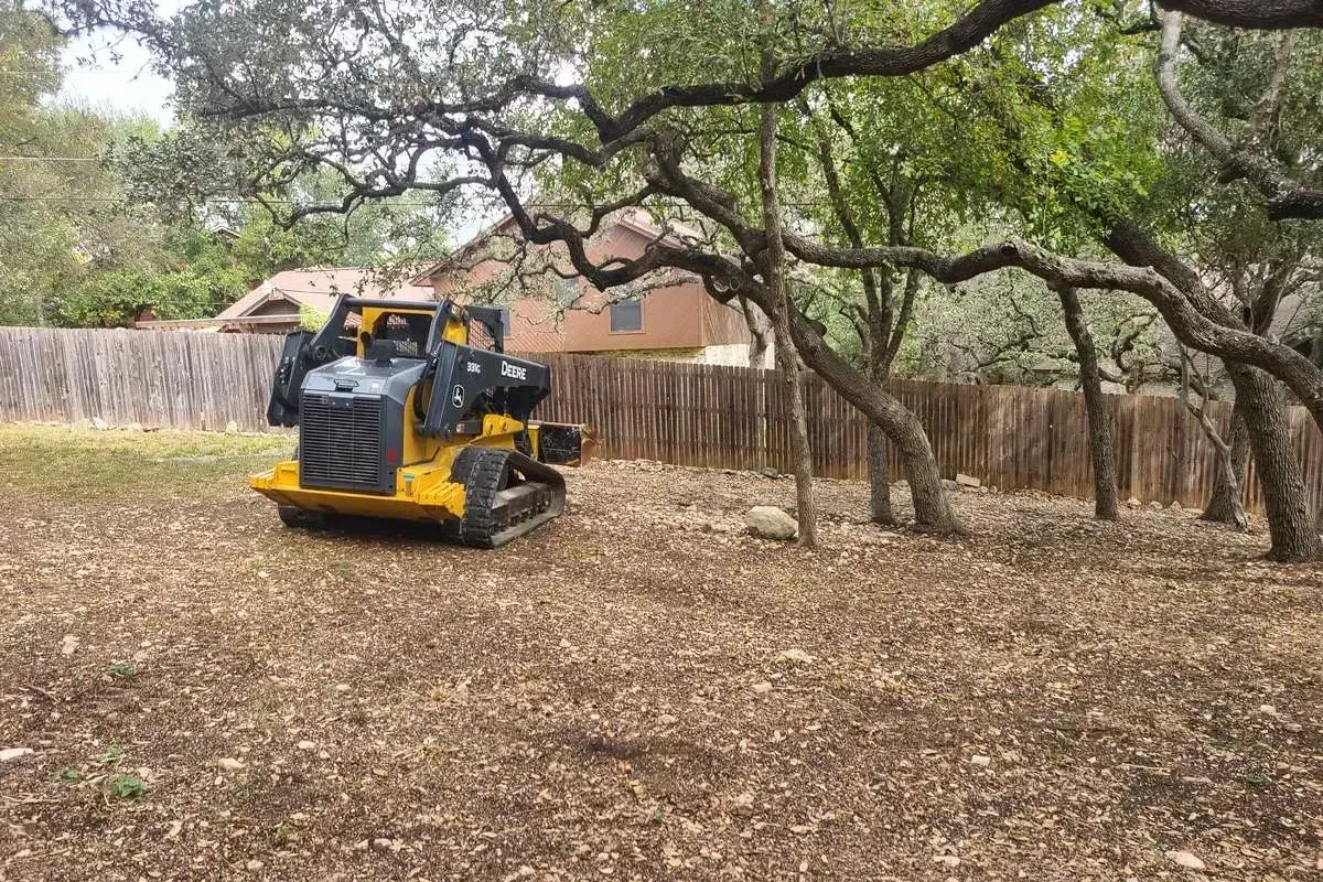 Track loader clearing a lot in Conroe, Texas.