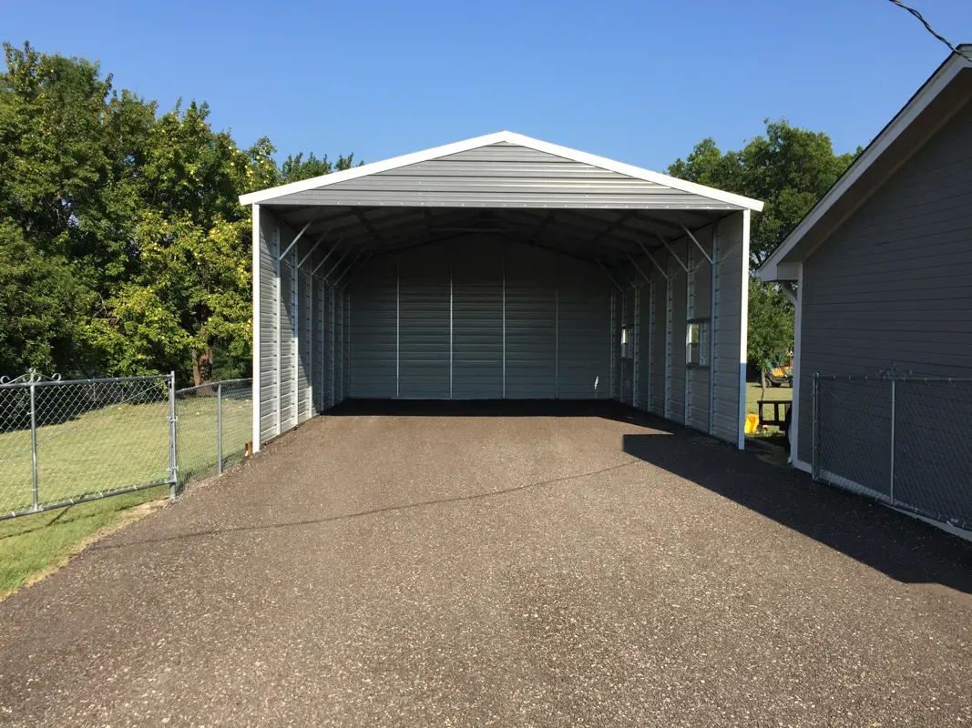 Newly installed gravel pad and gravel driveway for RV carport in Huntsville, TX. 
