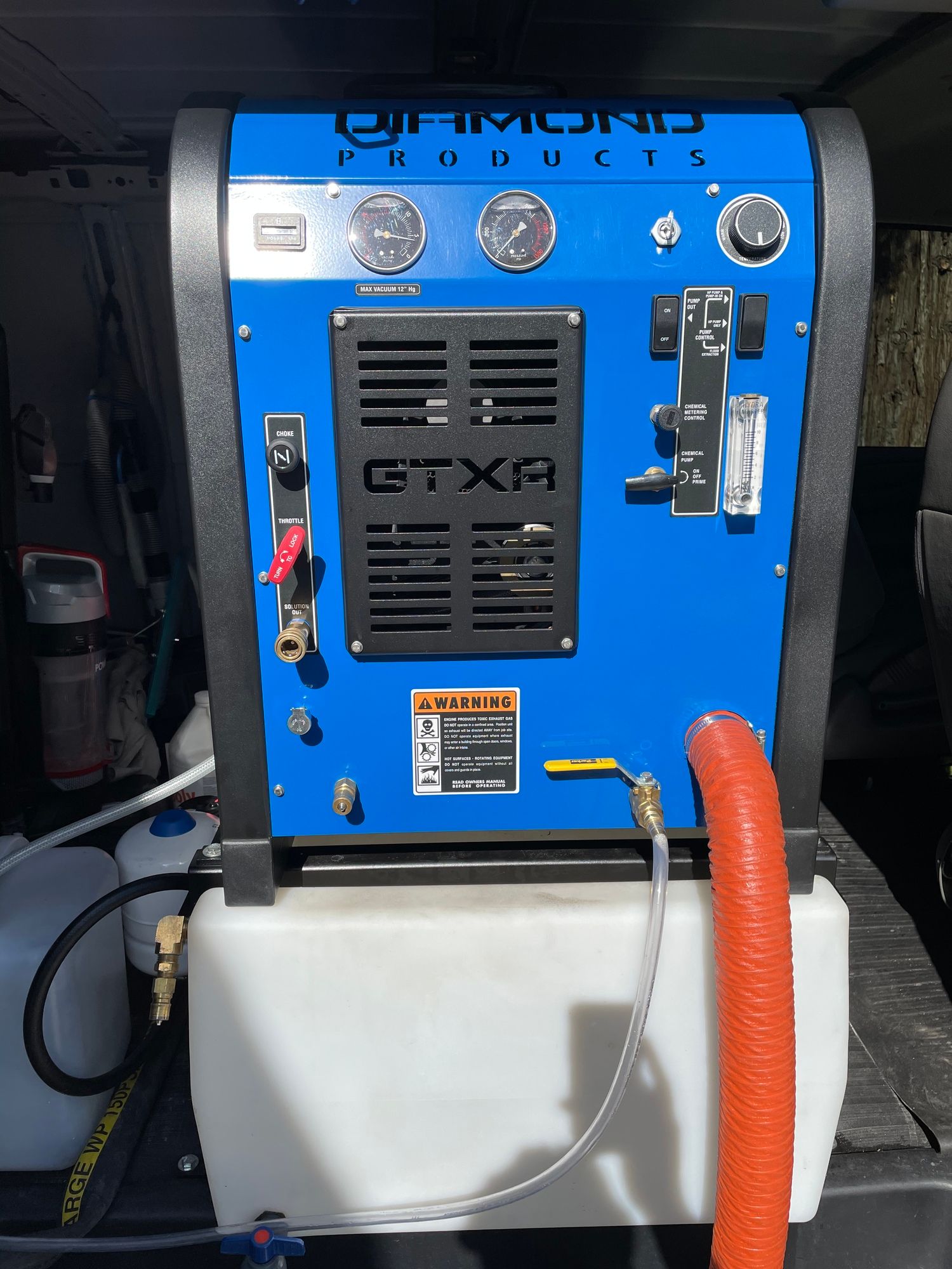 a diamond products machine with a hose attached to it
