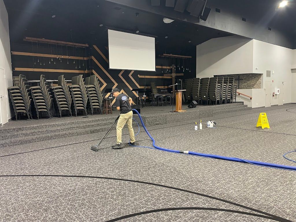 a mop is sitting on a tiled floor in a room