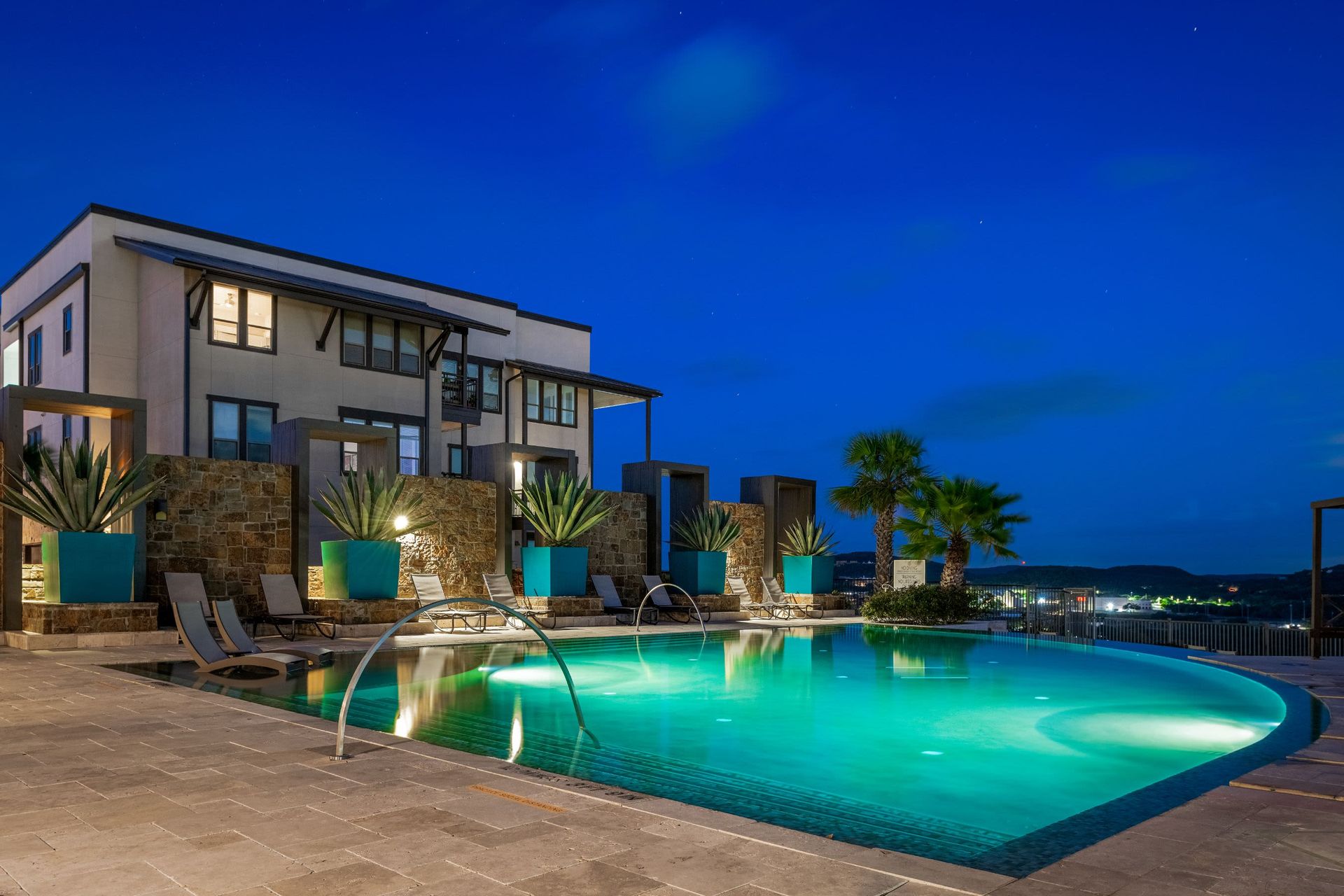 Swimming pool at night at Marquis Cresta Bella in San Antonio, TX.