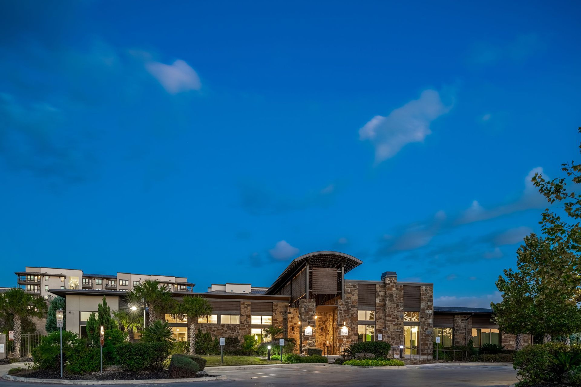 Exterior of community at night at Marquis Cresta Bella in San Antonio, TX.