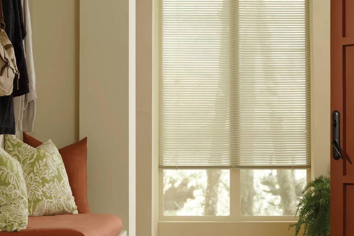 Hunter Douglas Modern Precious Metals® Mini Blinds in a seating area