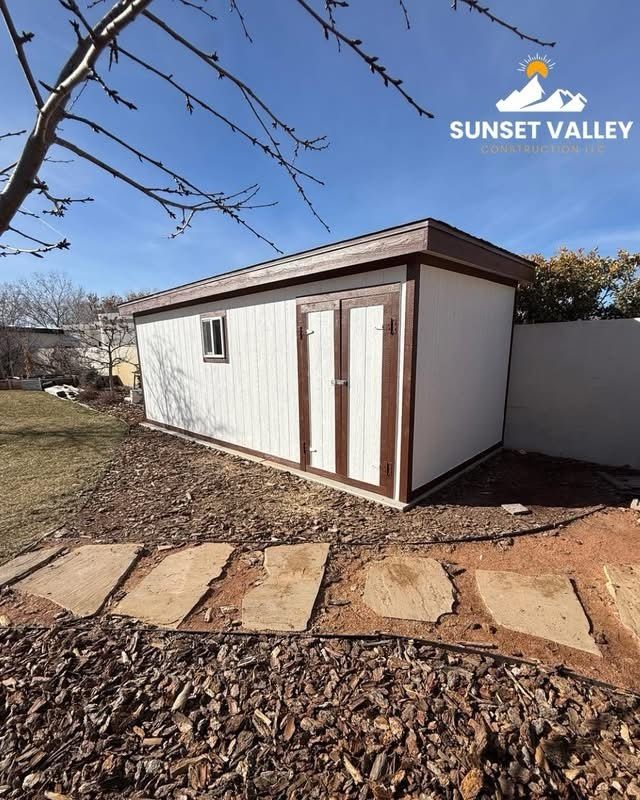 A newly poured concrete slab in a backyard, with the