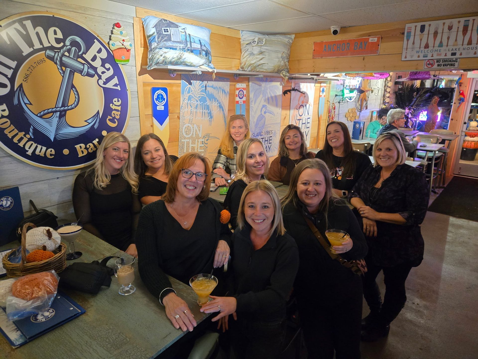 Group of women smiling at the bar 