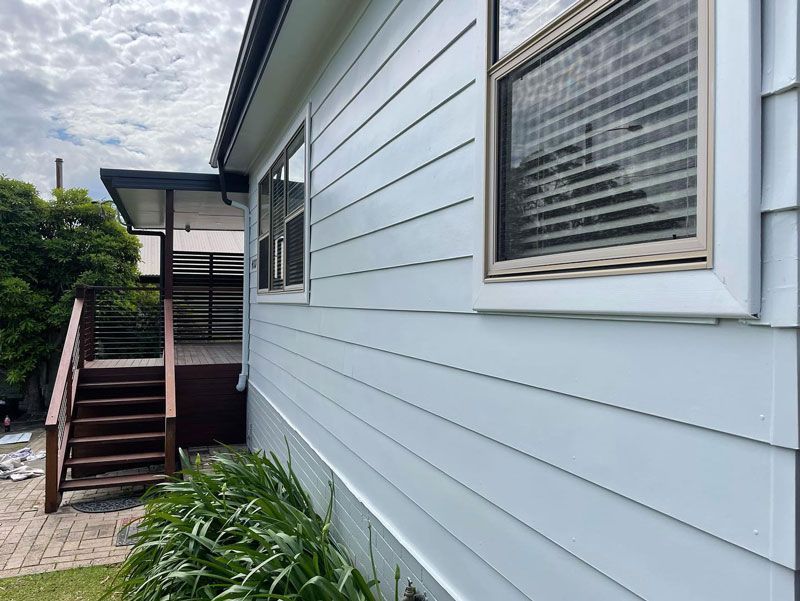 The Side of a White House With Stairs Leading Up to It — The Big Bearded Painter In Booral, NSW