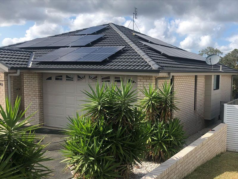 A House With a Garage and Solar Panels on the Roof — The Big Bearded Painter In Hamilton, NSW