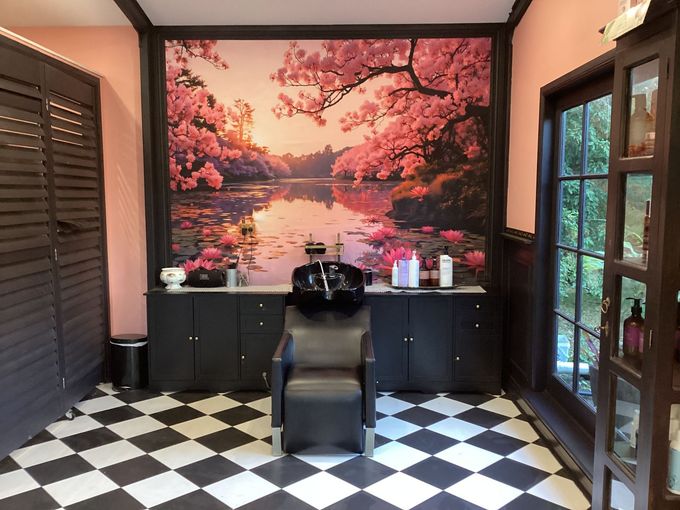 A Woman Is Getting Her Hair Cut By A Hairdresser In A Salon — Kabello Salon In Airlie Beach, QLD