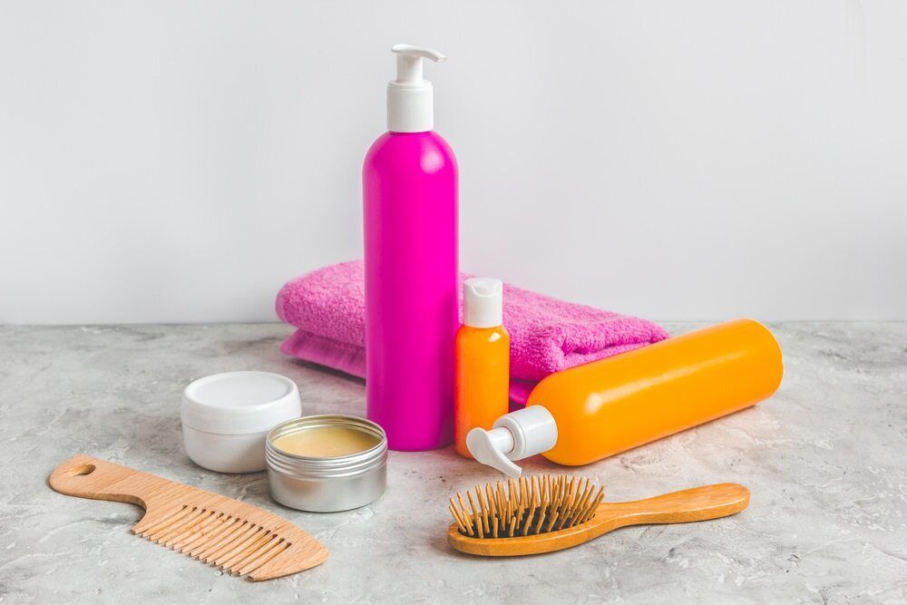 There Are Many Different Types Of Hair Products On The Table — Kabello Salon In Airlie Beach, QLD