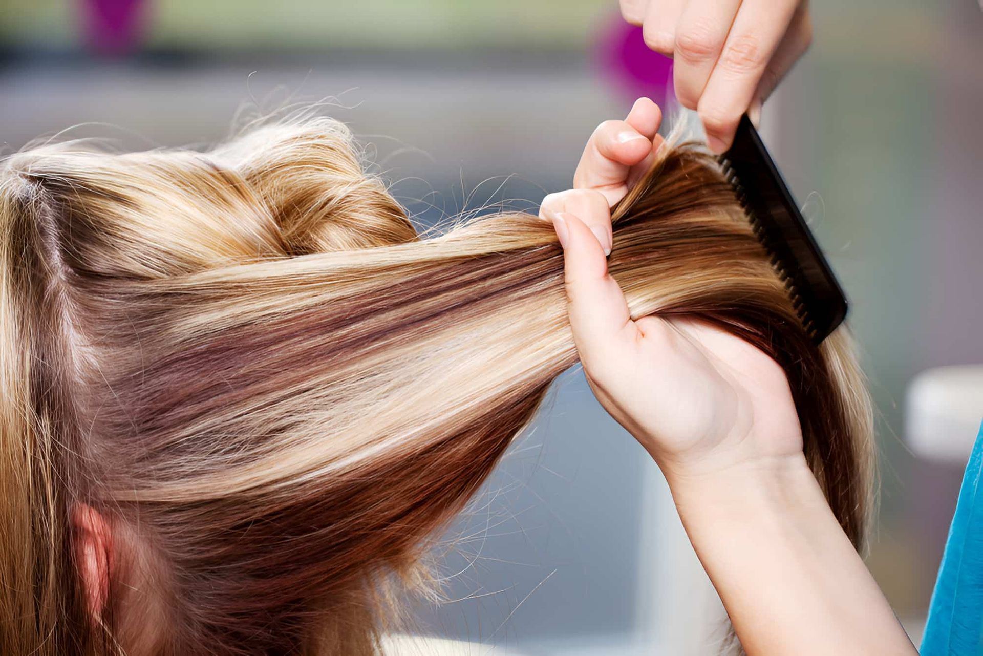A Woman Is Getting Her Hair Done — Kabello Salon In Airlie Beach, QLD