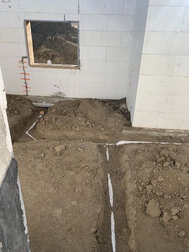 A room with a lot of dirt and a window.