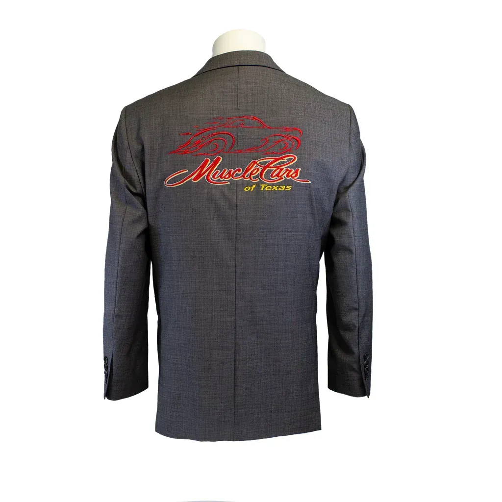 Gray men's blazer with two buttons, front view. Black shirt visible underneath.