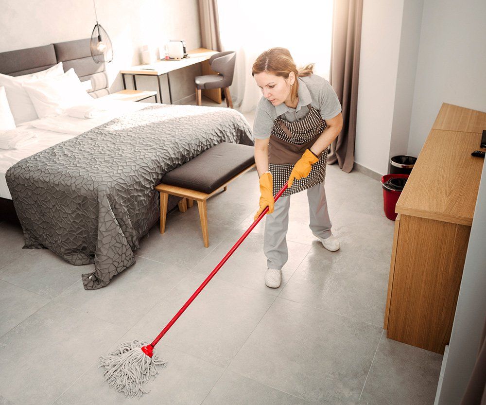 Worker Cleaning The Floor — Laguna Niguel, CA — Margaret’s Cleaning Service Worker Cleaning The Floor — Laguna Niguel, CA — Margaret’s Cleaning Service