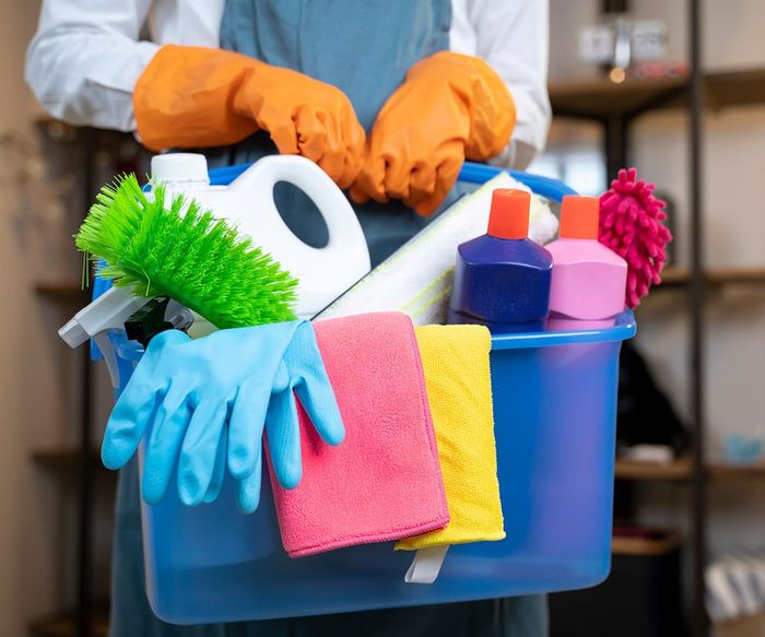 Person Holding Cleaning Products — Laguna Niguel, CA — Margaret’s Cleaning Service Person Holding Cleaning Products — Laguna Niguel, CA — Margaret’s Cleaning Service