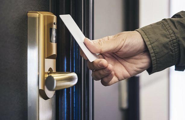 Man using card on a card reader access control system
