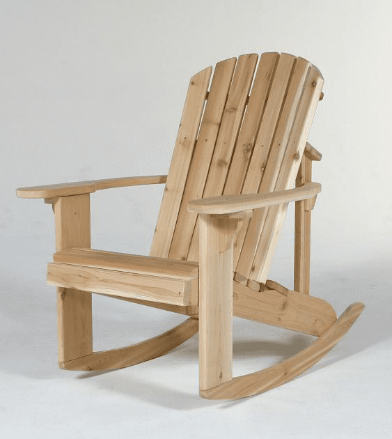 A wooden rocking chair is sitting on a white surface