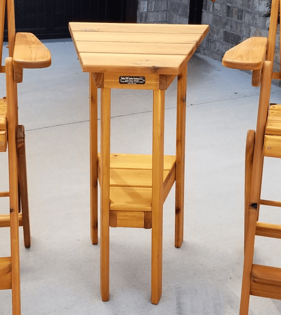A wooden table with the word camp on it