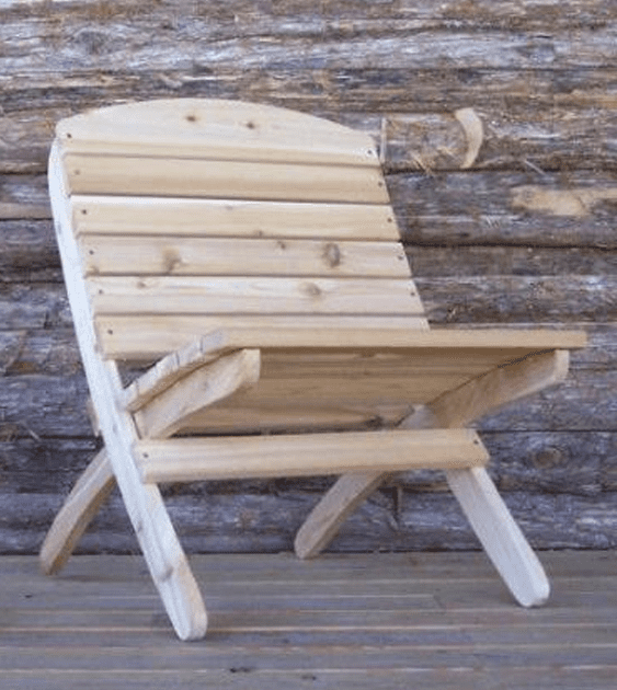 A wooden chair is sitting in front of a log wall