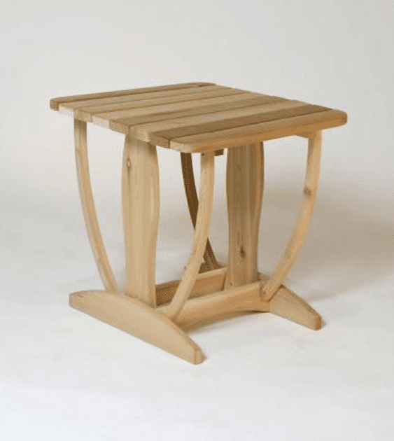 A small wooden table is sitting on a white surface