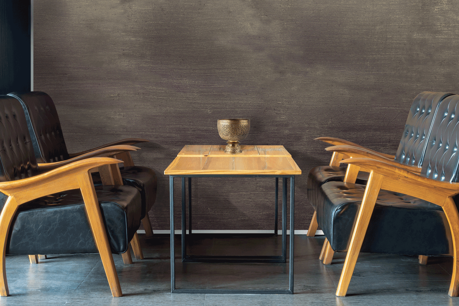 There are two chairs and a table in the room.