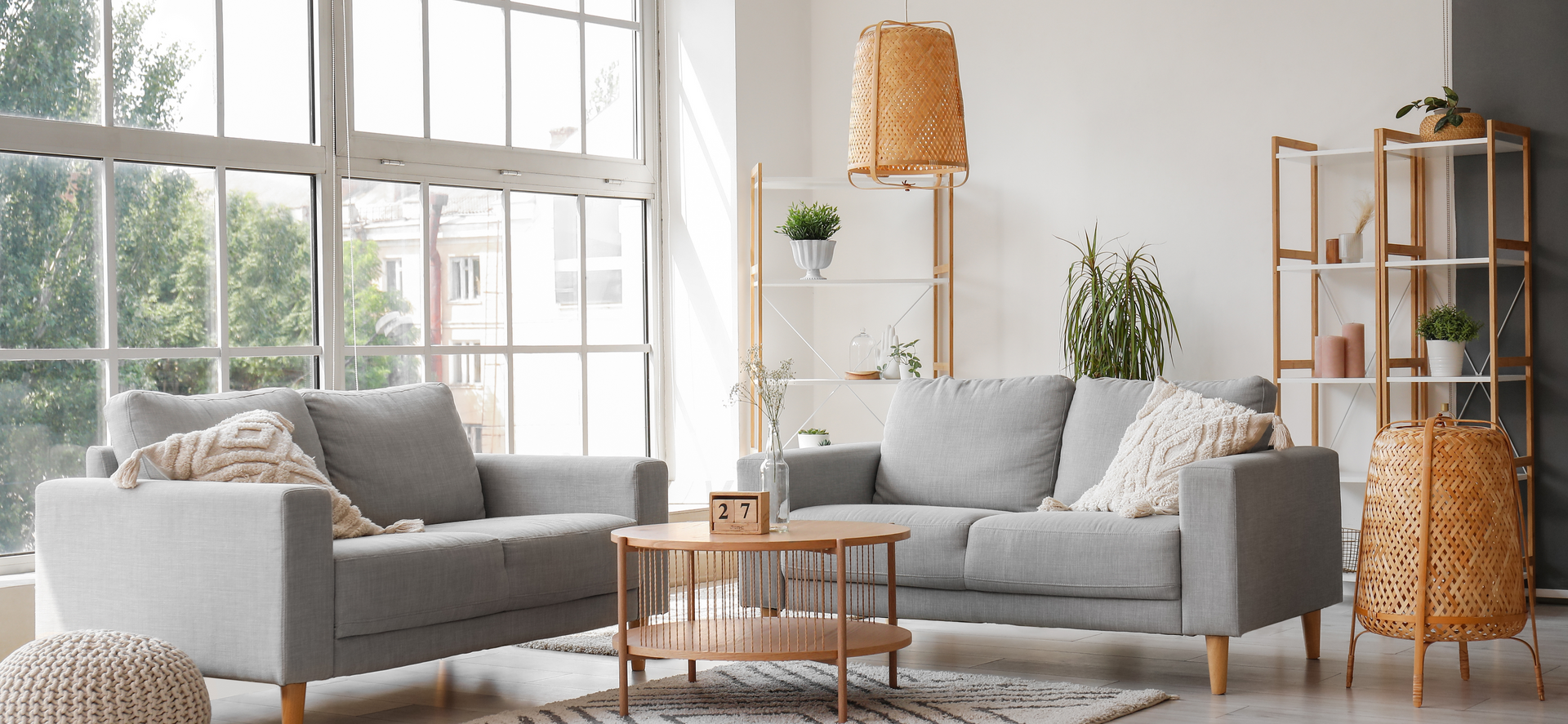 A living room filled with furniture and a large window.