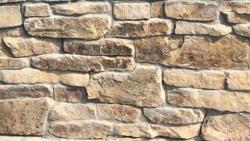 A close up of a stone wall with a lot of bricks.